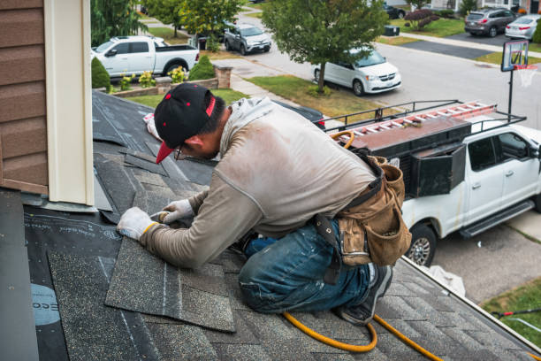 Professional Roofing technician working in Harvard, MA